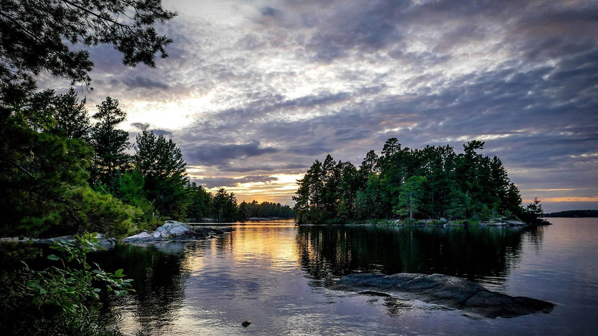 Park ranger dies responding to call for help when rescue boat capsizes on lake  at george magazine