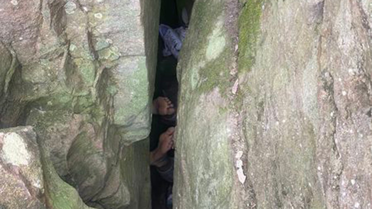 Woman becomes stuck upside down between boulders for 7 hours while trying to retrieve dropped phone  at george magazine