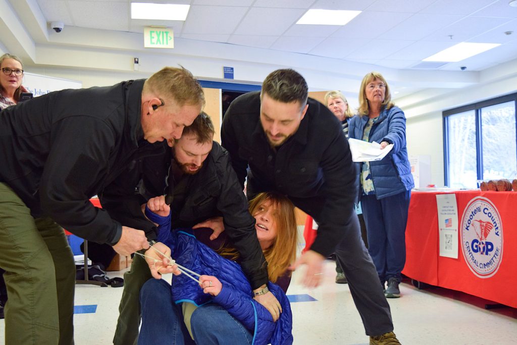 She Interrupted a Town-Hall Meeting and Was Dragged Out by Private Security