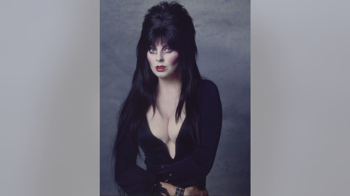 Horror hostess Elvira trolls Meghan Markle over pandemic hair dye comparison  at george magazine