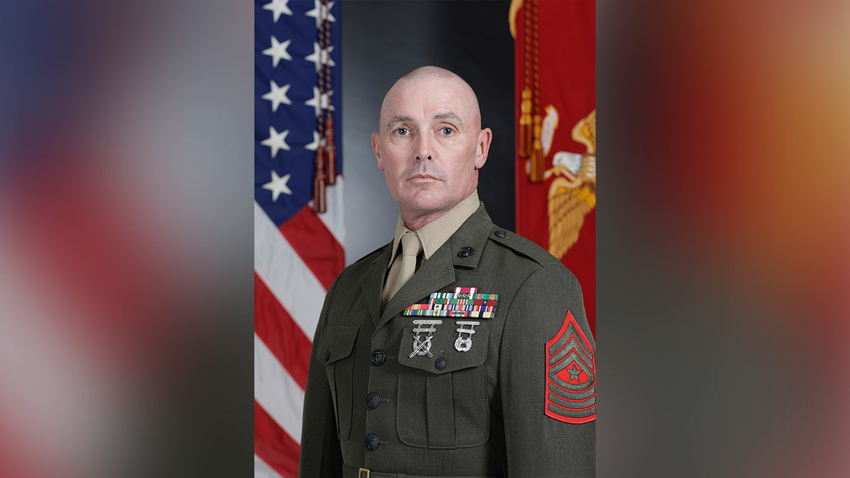 Marine restrains man allegedly trying to open plane’s emergency exit during flight  at george magazine
