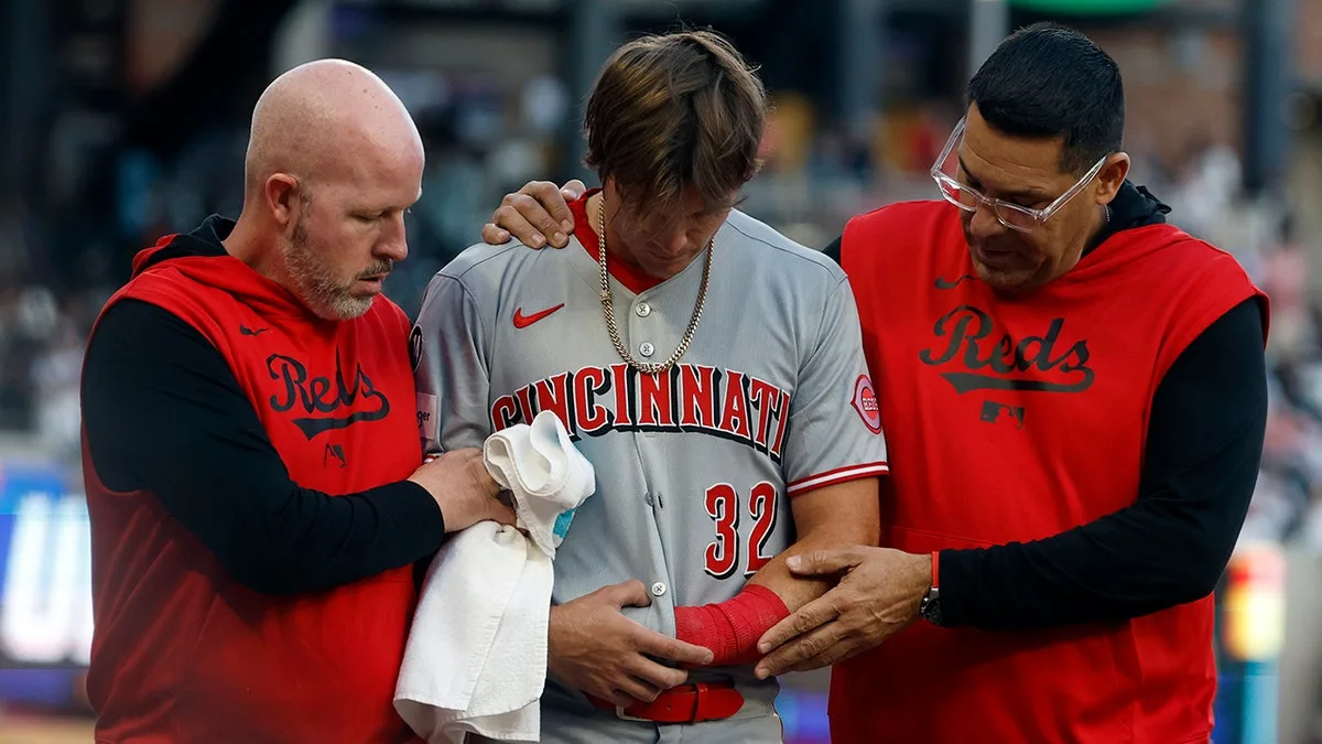 Reds rookie Tyler Callihan breaks arm crashing into wall while trying to make diving catch  at george magazine