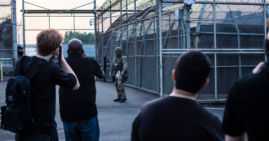 Law Enforcement Officers Respond to Reports of Unrest at Migrant Facility  at george magazine
