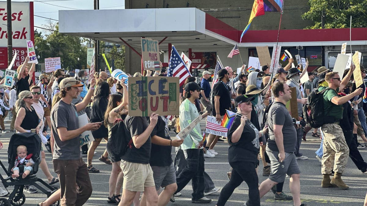 Innocent bystander gunned down at Utah protest as peacekeepers take aim at armed suspect  at george magazine