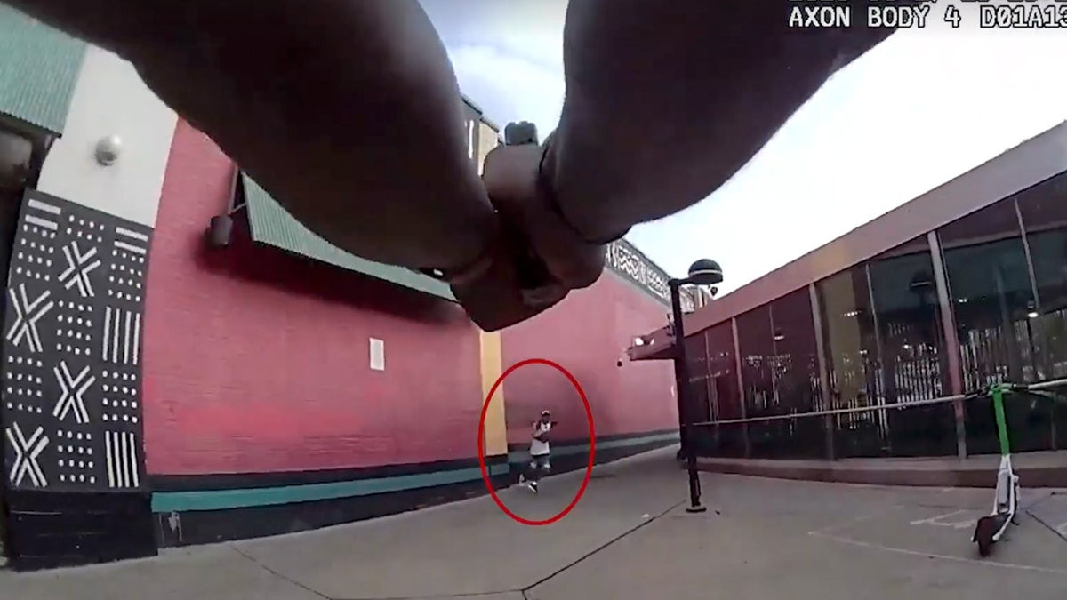 Suspect killed, officer injured in Baltimore shooting as bodycam captures cries of 'cease fire'  at george magazine
