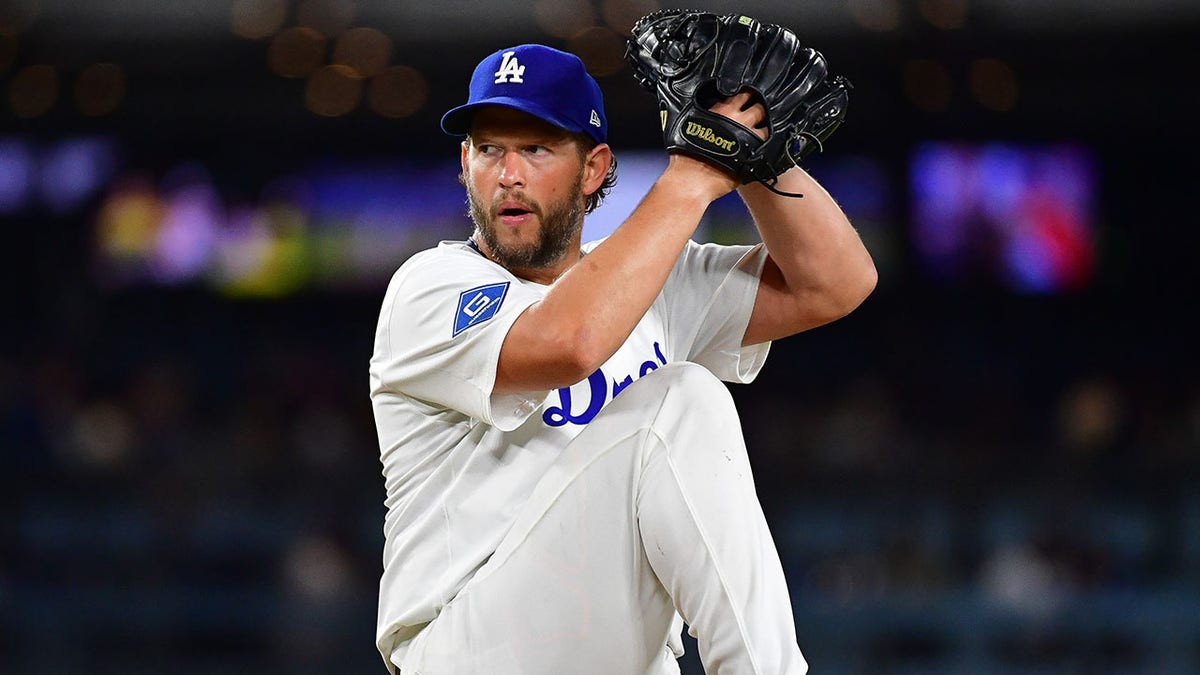 Dodgers pitcher Clayton Kershaw displays Bible passage on hat during Pride Night  at george magazine