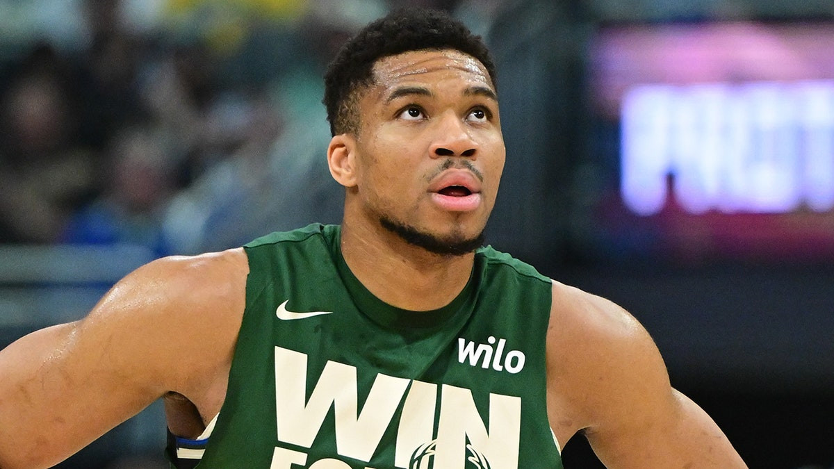 Bucks' Giannis Antetokounmpo shows off 4-word message on guns  at george magazine