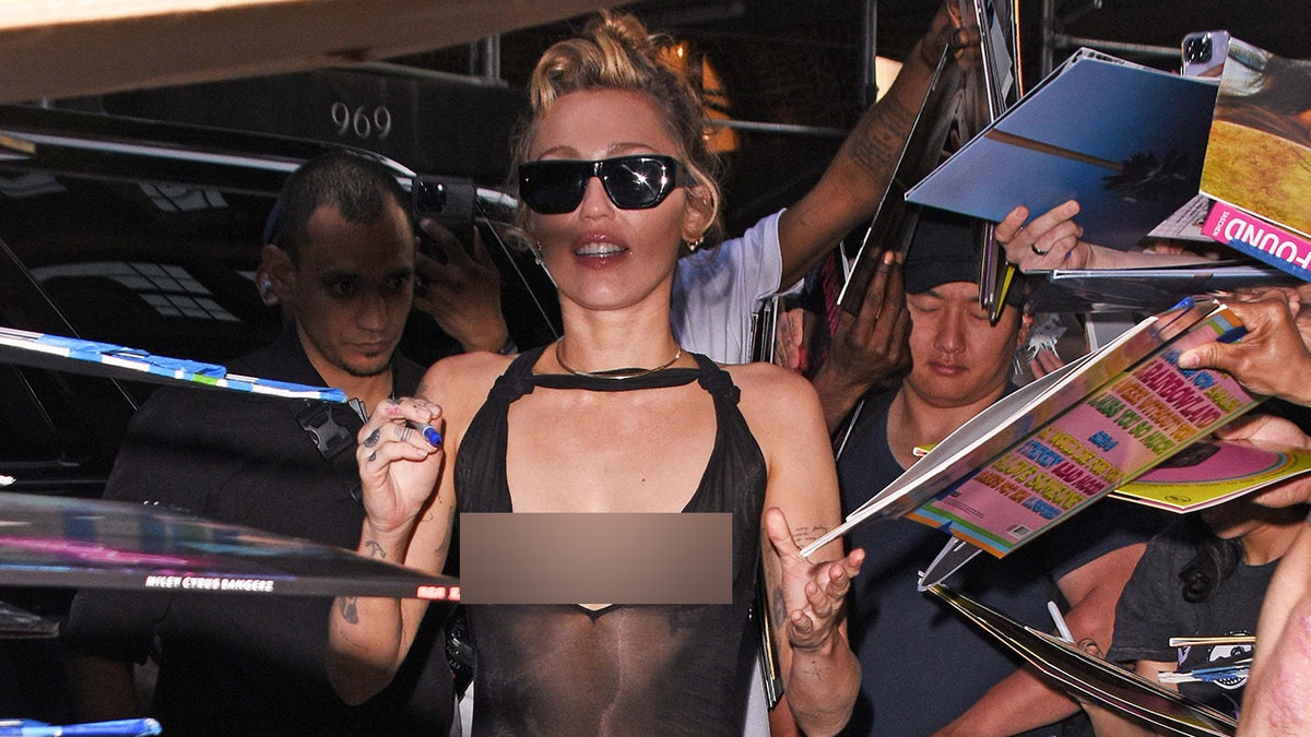 Miley Cyrus stuns fans in daring dress during New York album signing  at george magazine