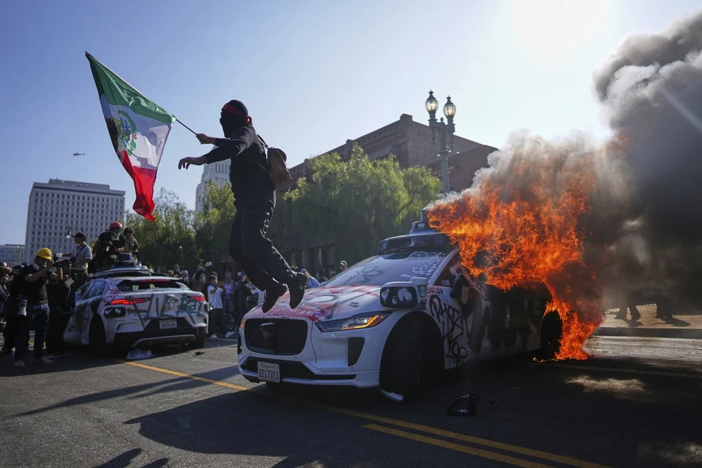 Trump says LA protests not ‘quite an insurrection’ after earlier ‘paid insurrectionists’ comment  at george magazine