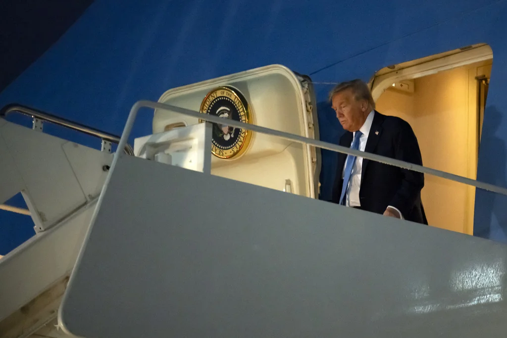 Trump warns Iran not to attack US troops upon early return to DC  at george magazine