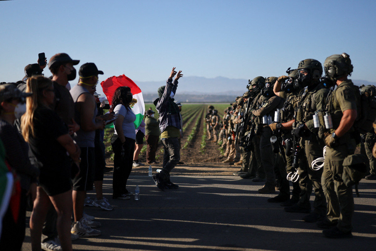 Federal Agents Clash With Protesters During Immigration Raid at California Farm  at george magazine