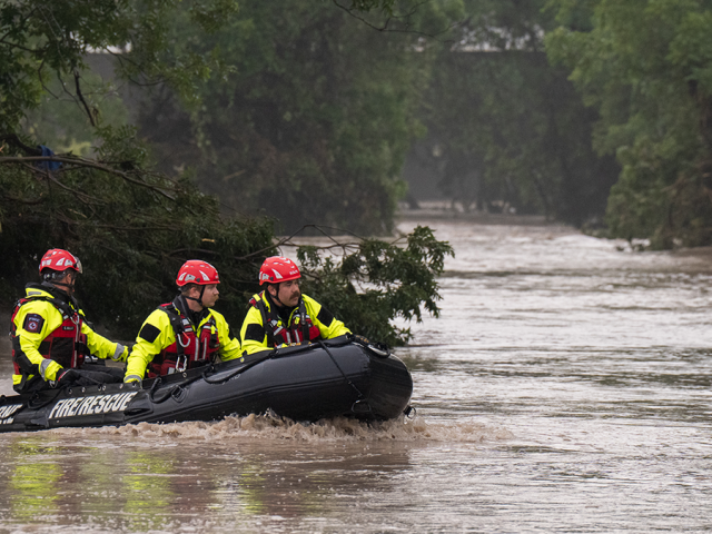 Texas family helps rescue woman clinging to tree after being swept 20 miles downriver