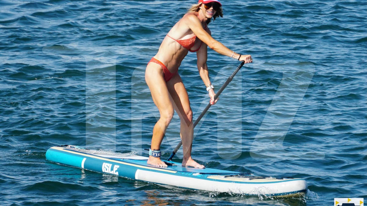 Lara Trump enjoys paddleboarding in orange bikini during summer vacation in Rhode Island  at george magazine