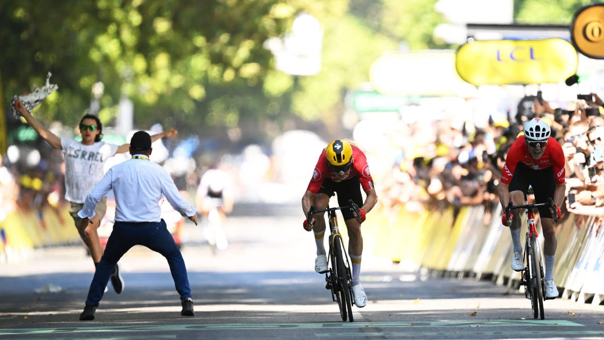 Security guard's 'swift move' stops determined anti-Israel agitator at Tour de France finish  at george magazine
