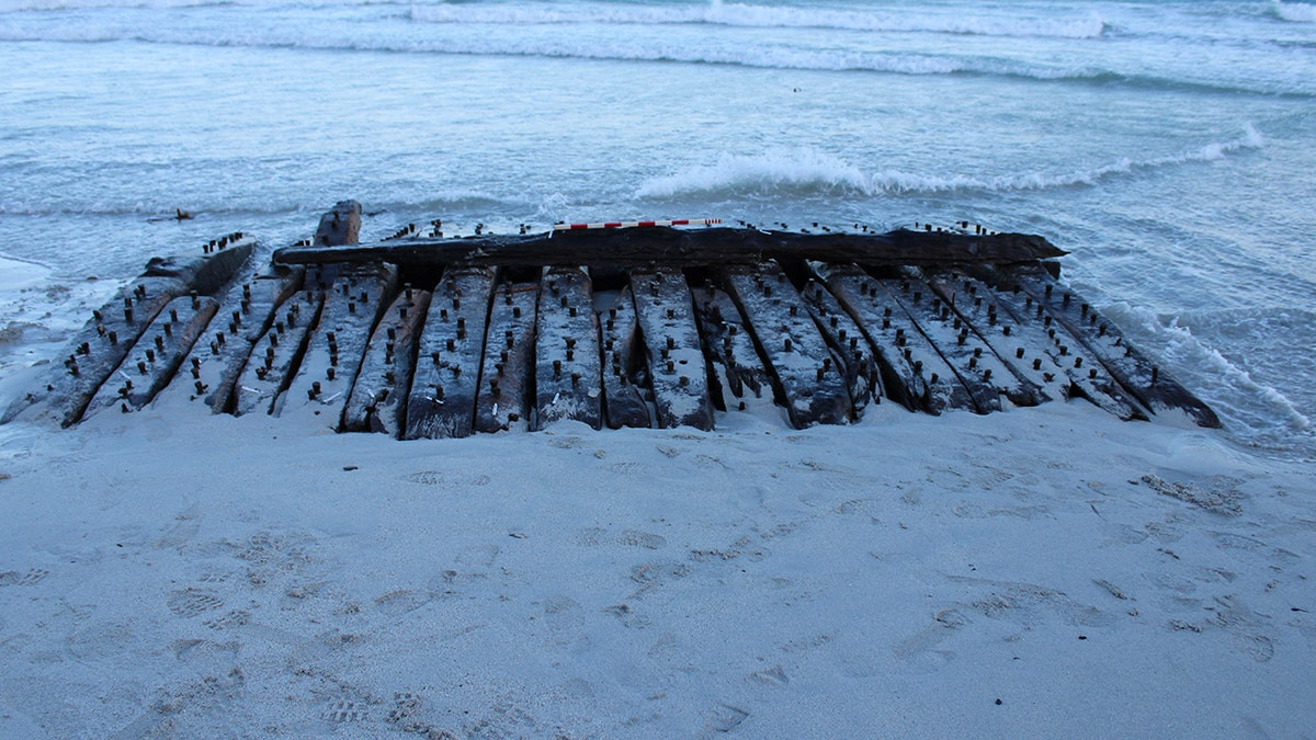 Schoolboy spots American Revolution warship on beach after storm uncovers 230-year-old wreck  at george magazine