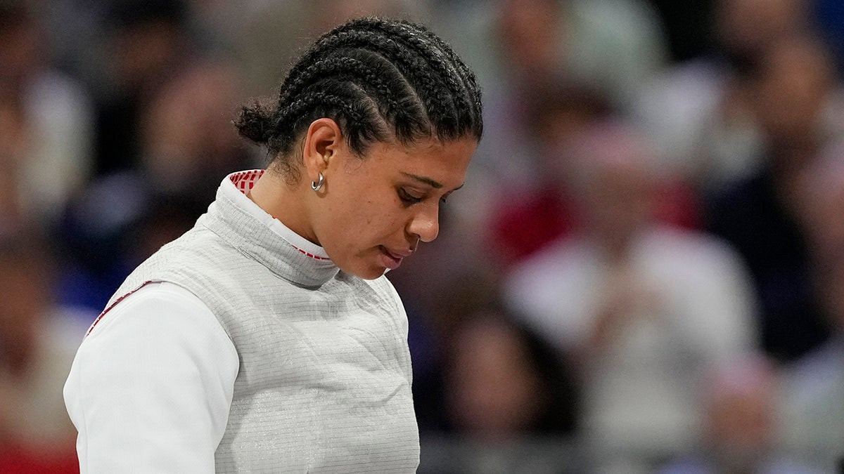 French Olympic fencer's kiss contamination defense holds up in court as she's cleared of doping violation  at george magazine