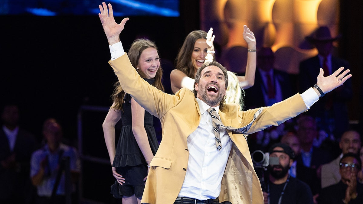 Brand new NFL Hall of Famer has wardrobe malfunction doing signature sack celebration  at george magazine