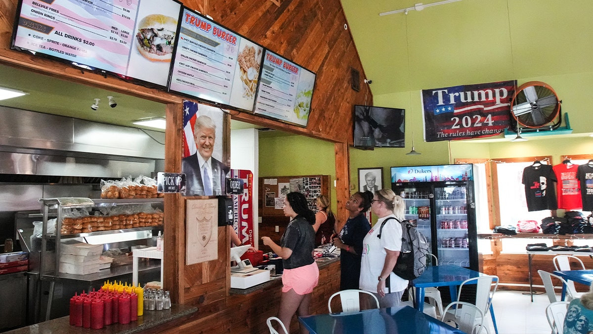 Owner of Trump-themed burger chain faces deportation after feds allege illegal status, 'sham' marriages  at george magazine