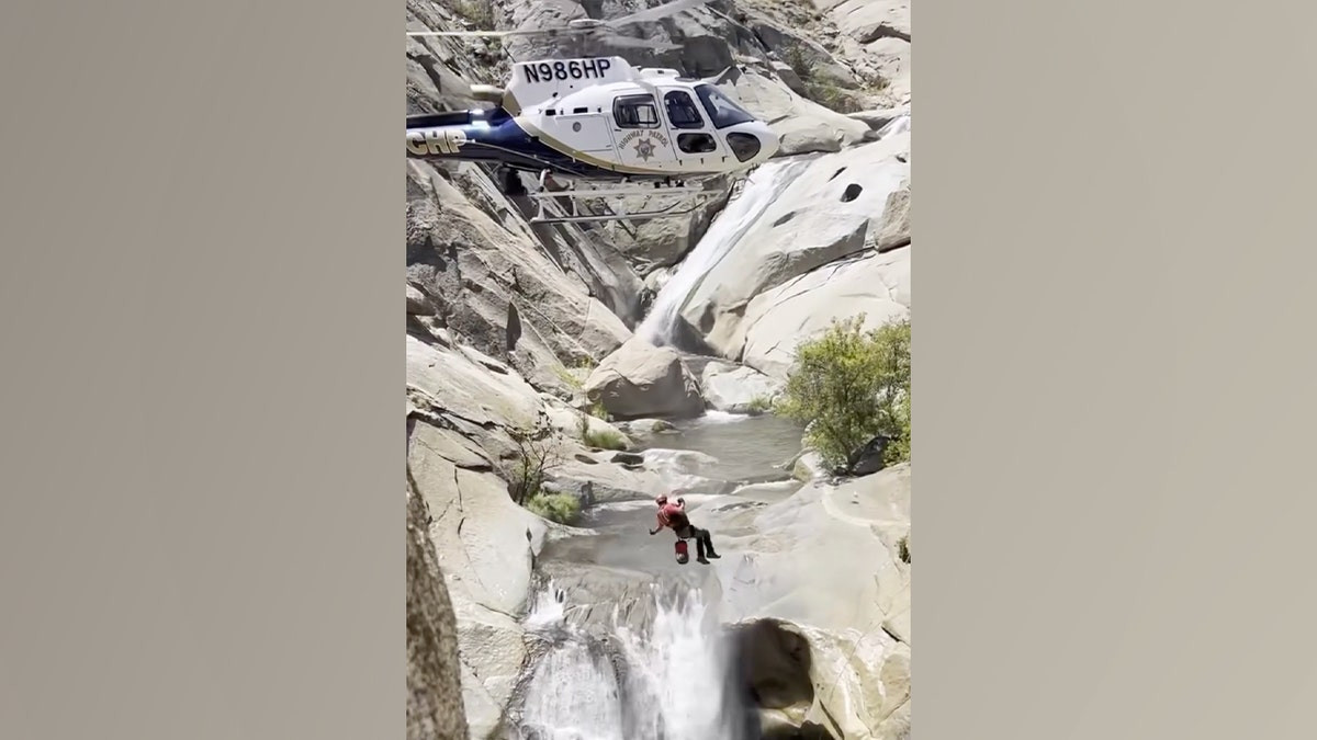 California man rescued by helicopter after spending two days trapped behind waterfall  at george magazine