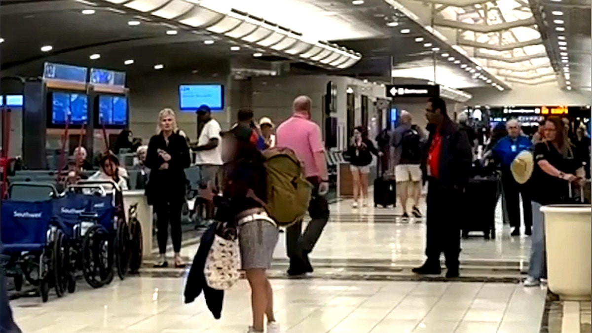 Woman kicks Southwest employee, punches computer monitors in violent airport meltdown  at george magazine