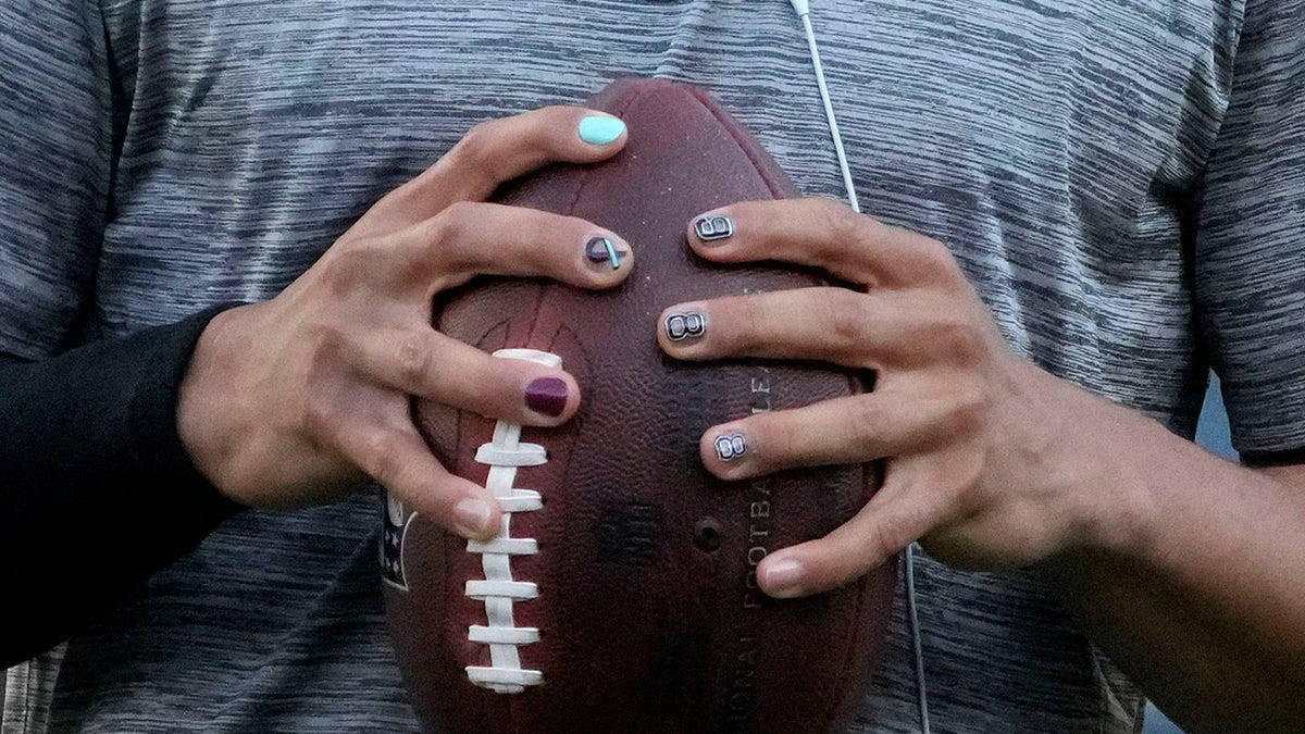 WNBA star Angel Reese shares Caleb Williams connection after NFL player's message on painted fingernails  at george magazine