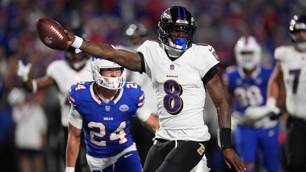 Ravens' Lamar Jackson shoves fan after getting smacked in helmet following TD strike  at george magazine