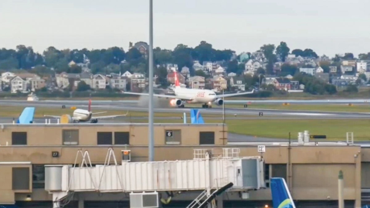 Passenger jet aborts Boston takeoff after flame and smoke spew from engine  at george magazine