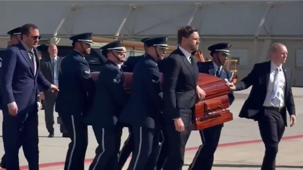 Vice President JD Vance escorts Charlie Kirk's casket before flight on Air Force Two from Utah to Arizona  at george magazine