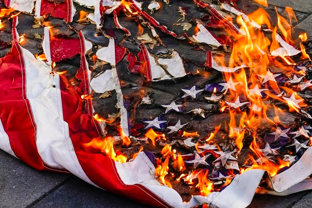 Trump advises that anyone burning American flag will be imprisoned for a year  at george magazine