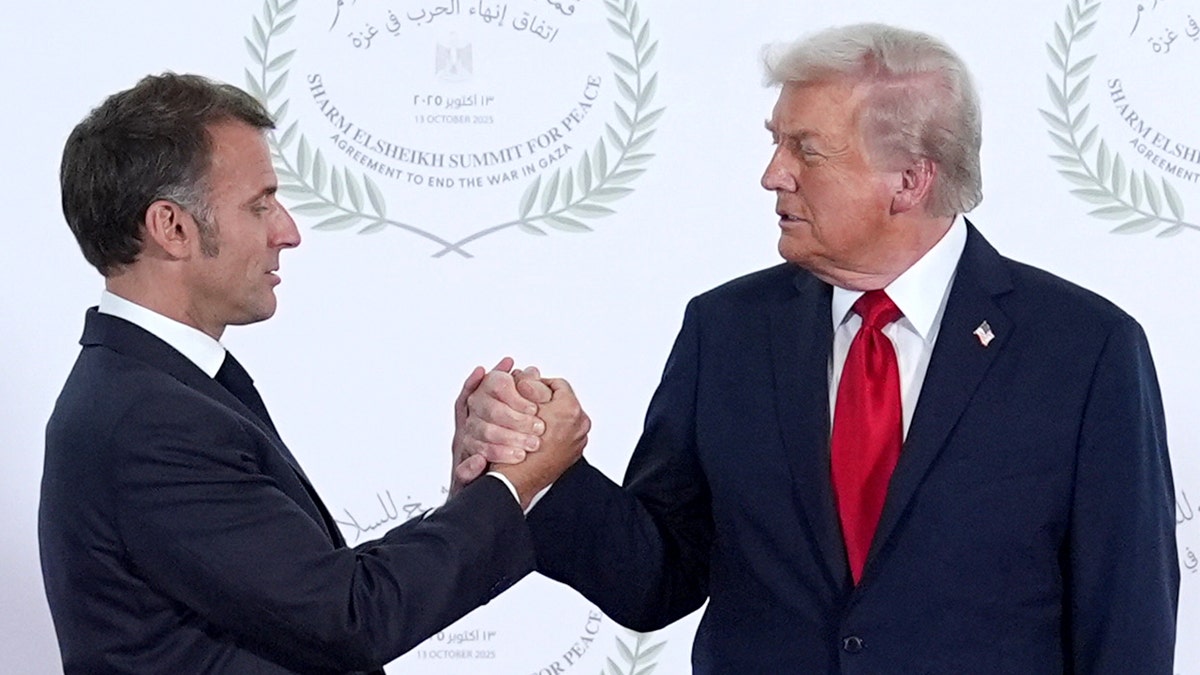 Watch Trump and France's Macron share weirdly long 26-second marathon handshake  at george magazine