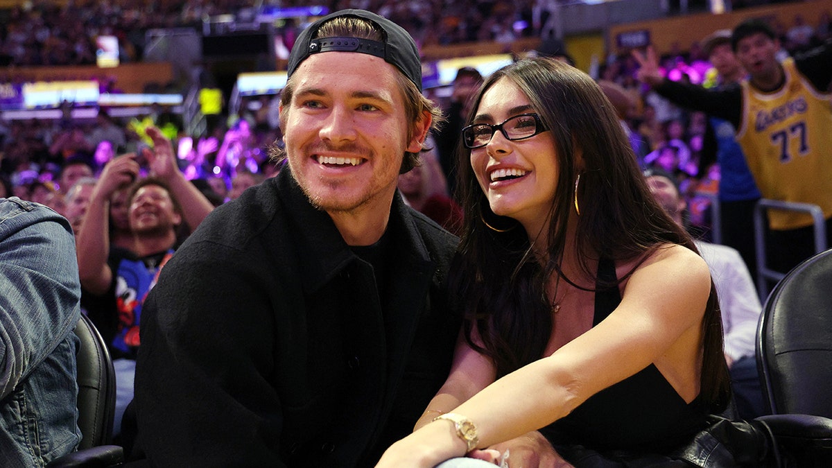 Justin Herbert goes viral for saving Madison Beer from flying basketball at Lakers game amid romance rumors  at george magazine
