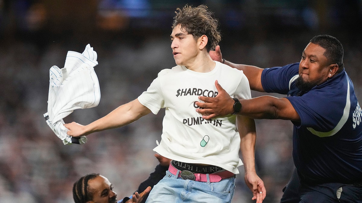 2 field invaders cause stir during Yankees' ALDS Game 3 win over Blue Jays  at george magazine