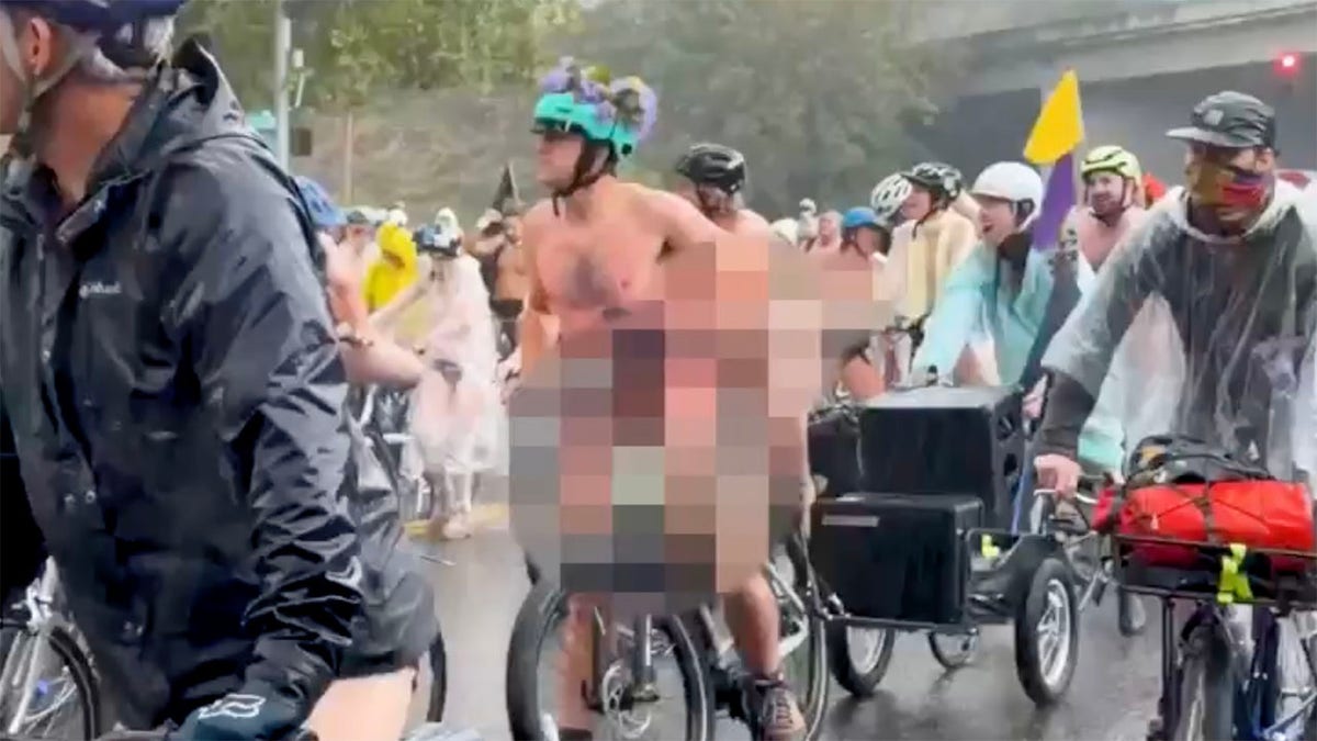 Bare-bottomed bikers roll through rain to shout at feds in blue city's latest anti-ICE stunt  at george magazine