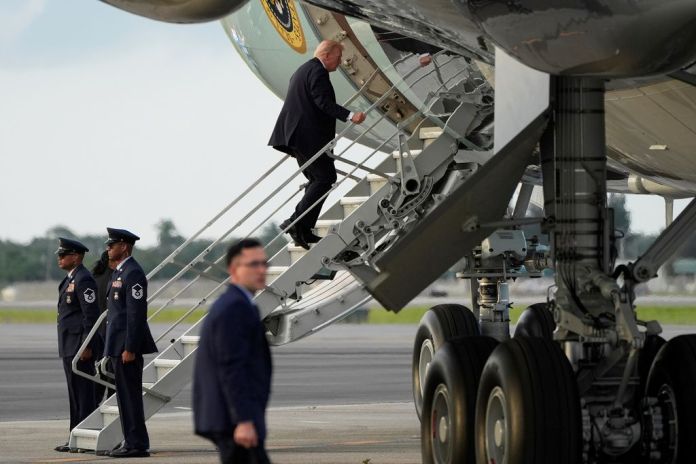 Trump boards Air Force One using small stairs after hunting stand found at airport  at george magazine