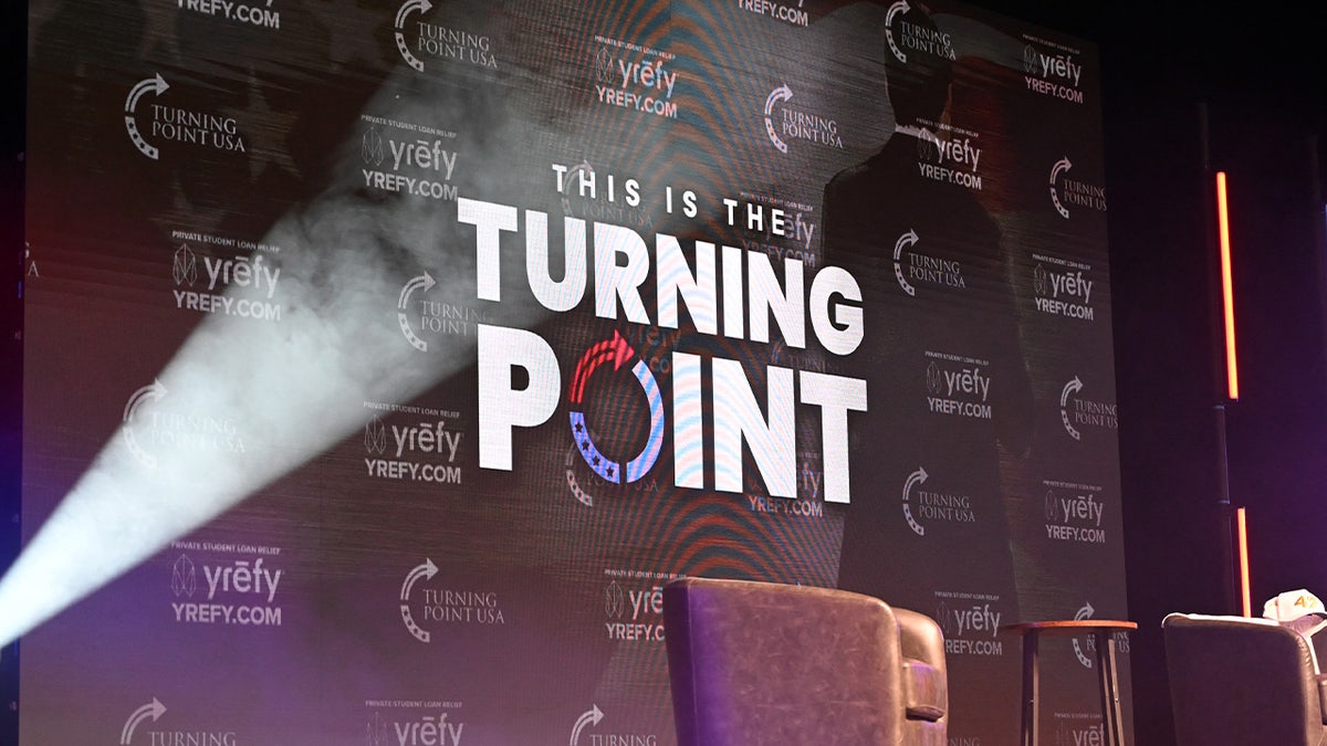 Illinois State University teacher's assistant flips Turning Point USA table, tears down flyers: 'Jesus did it'  at george magazine