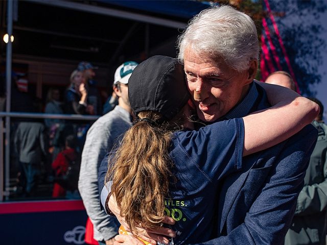 Bill Clinton spotted at NYC Marathon with bandaged nose while cheering on daughter Chelsea