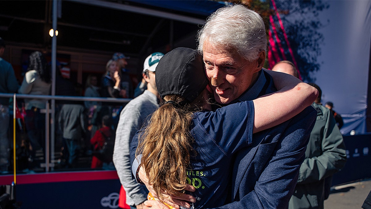 Bill Clinton spotted at NYC Marathon with bandaged nose while cheering on daughter Chelsea  at george magazine