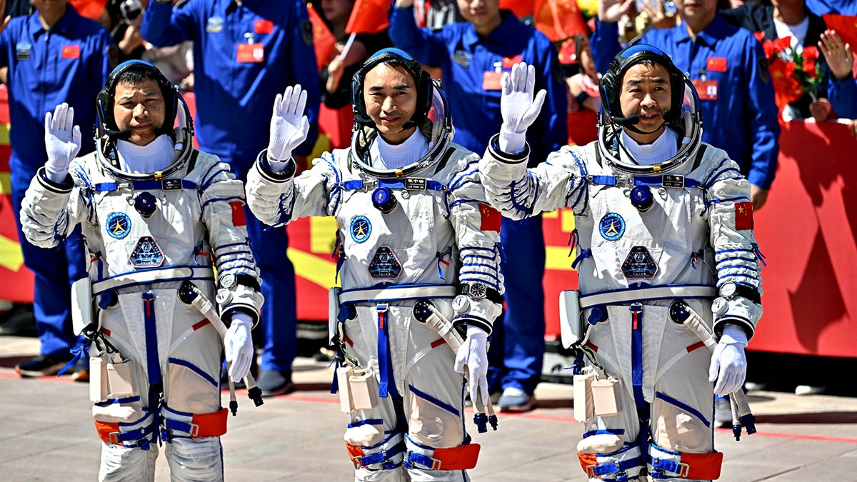 Chinese astronauts stranded in space after debris strikes return capsule during mission at george magazine
