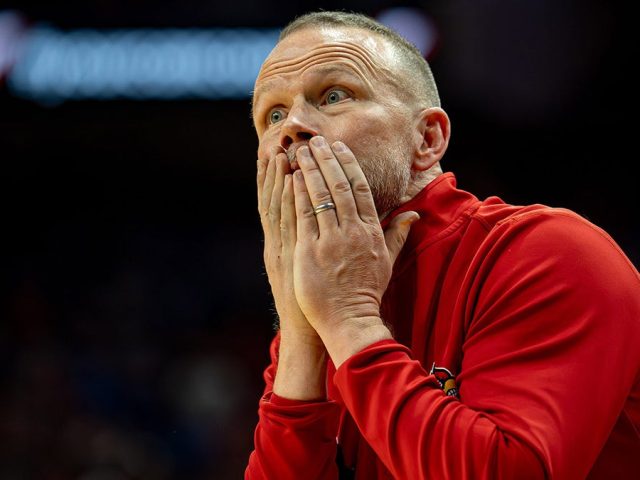 Louisville men’s basketball coach suffers bizarre injury trying to avoid celebration