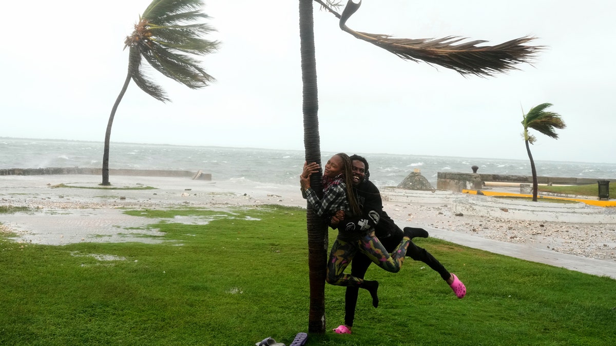 Influencers face backlash for 'tragedy tourism' during Hurricane Melissa at george magazine