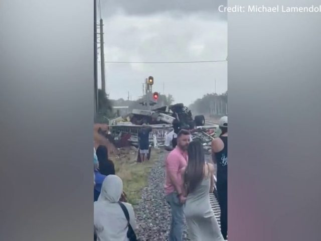 Train pushes car quarter-mile on tracks as 82-year-old driver suffers minor injuries