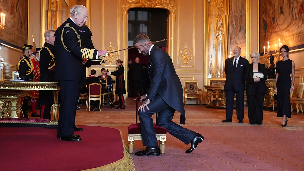 David Beckham knighted by King Charles for services to sport and charity at george magazine
