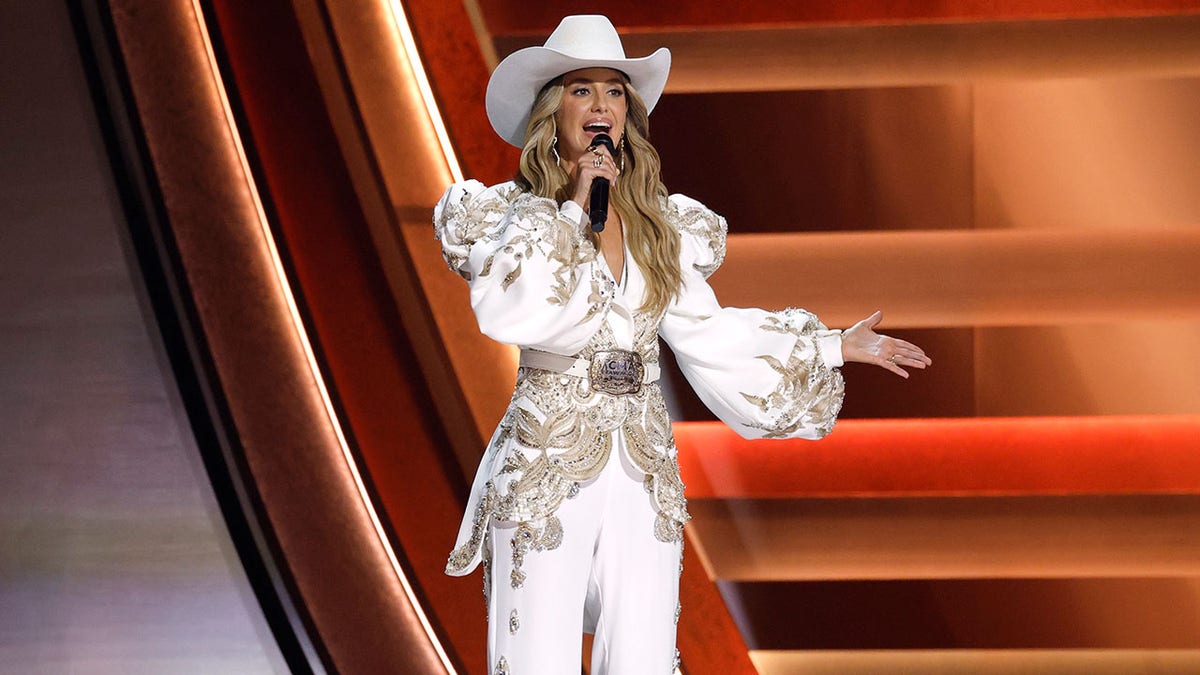 Elizabeth Hurley, Billy Ray Cyrus steal CMAs grooving to Chris Stapleton as Kenny Chesney rocks the stage  at george magazine