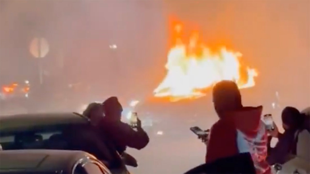 Video shows wild neighborhood street takeover as violent mob pummels couple, burns truck  at george magazine