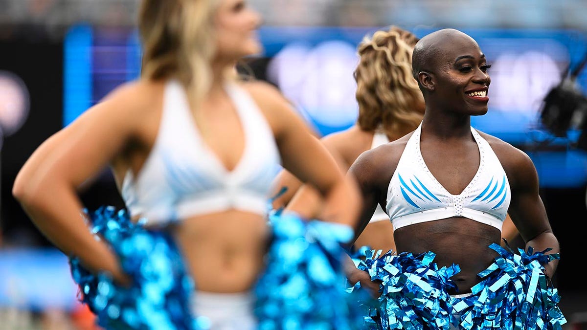 NFL's first transgender cheerleader makes claim about Panthers departure: 'I was cut because I’m trans'  at george magazine