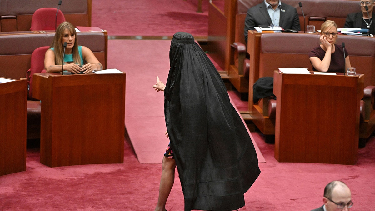 Australian senator wears burqa after move to block her face-covering ban bill  at george magazine