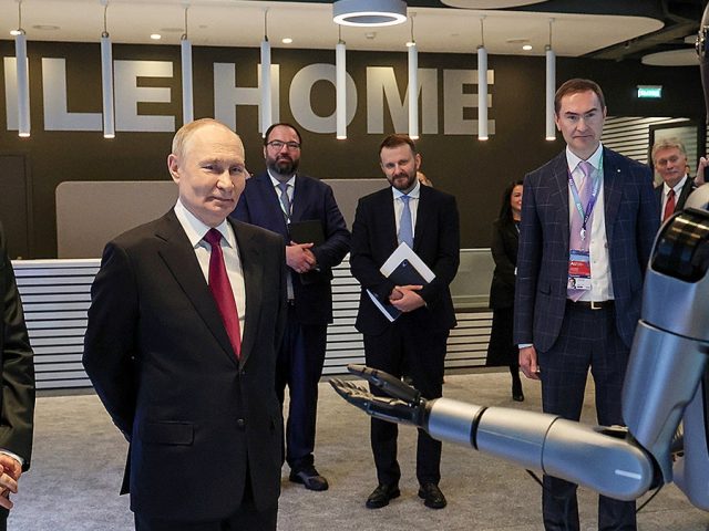 Putin calls dancing Russian robot ‘very beautiful’ in awkward AI conference moment