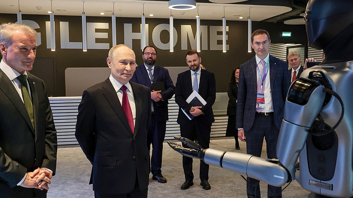 Putin calls dancing Russian robot 'very beautiful' in awkward AI conference moment at george magazine