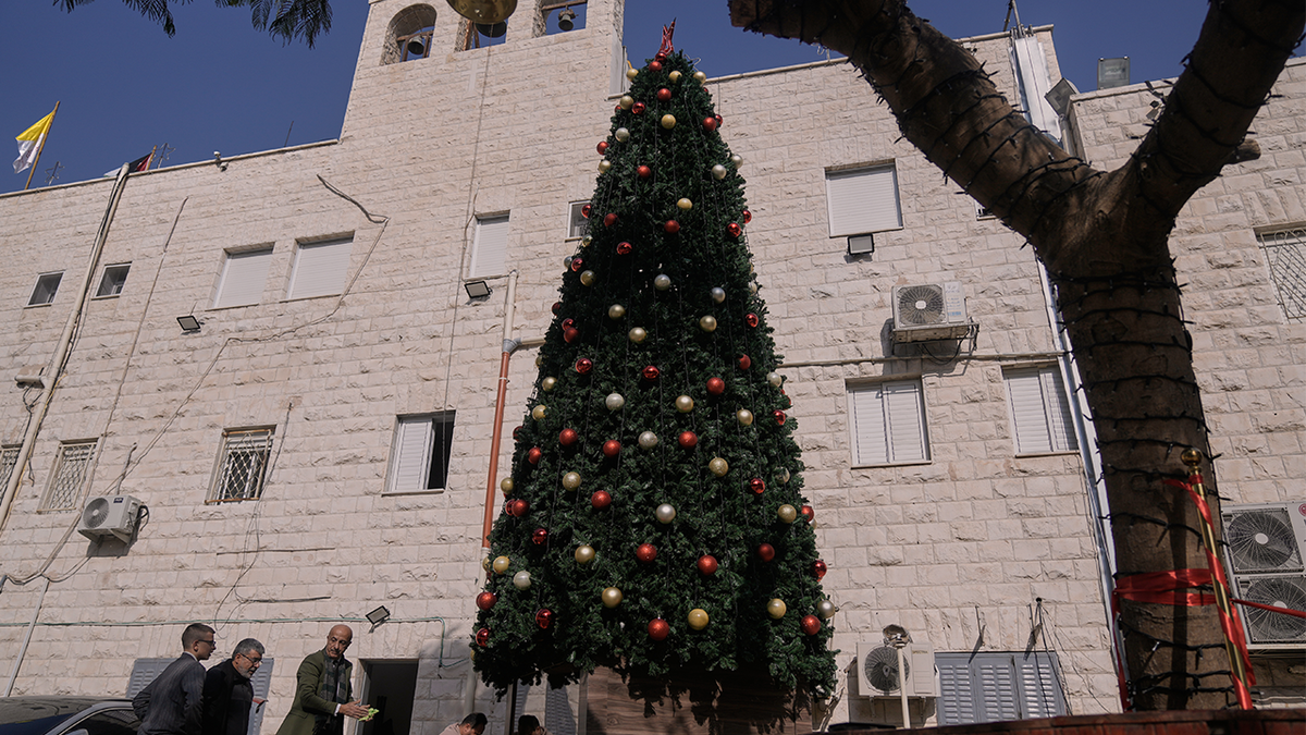 Trio of Palestinians arrested for allegedly torching Christmas tree at Catholic church in West Bank at george magazine