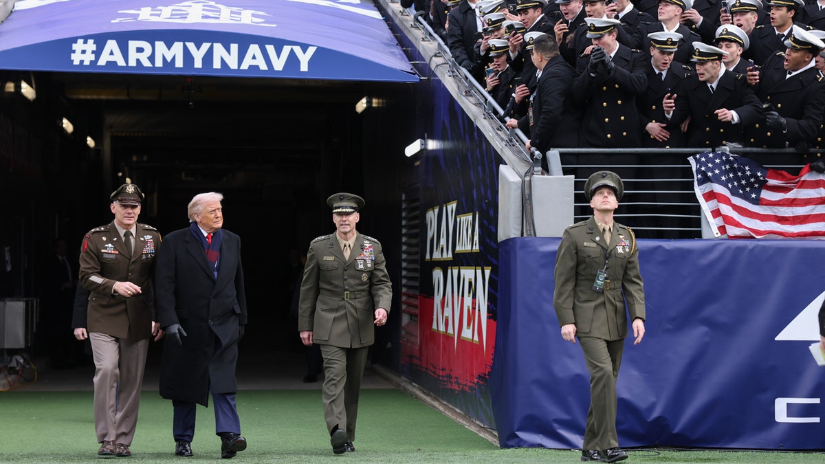 Protests erupt outside Army-Navy game amid Trump's attendance at george magazine